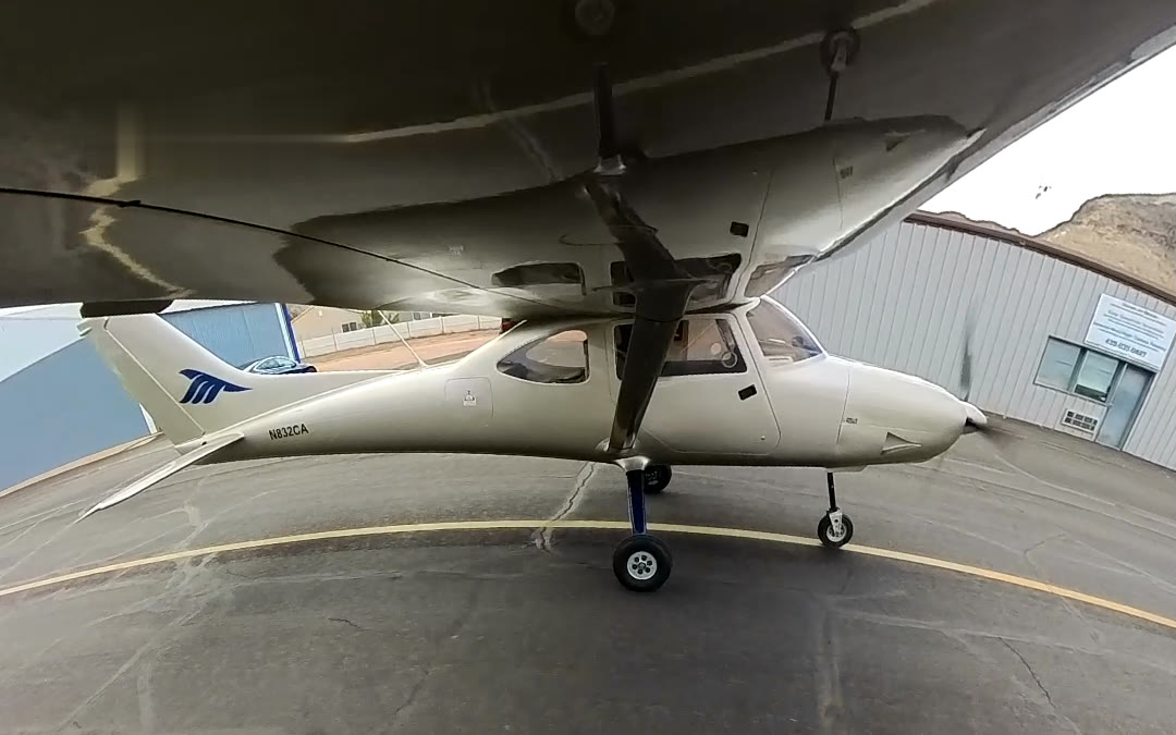 The white Sirius TL-3000 light-sport airplane, N832CA, on the ramp at Hurricane airport